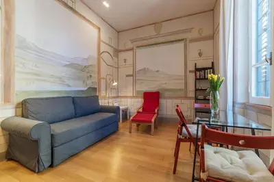 a living room with a couch and a table at Domus Claudiae - FromHometoRome in Rome
