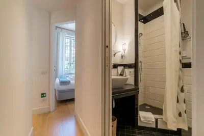 a bathroom with a sink and a mirror at Domus Claudiae - FromHometoRome in Rome