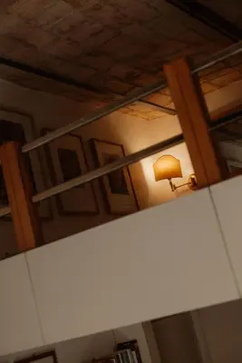 a room with a lamp and a light on a ceiling at Restart Accommodations Farnesina in Rome