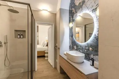 a bathroom with a sink and a mirror at Casa Alessandra in Rome