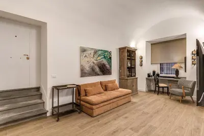 a living room with a couch and a table at Casa Alessandra in Rome