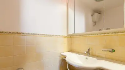 a bathroom with a sink and a mirror at Rental in Rome Otranto Relax in Rome