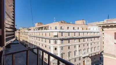 a view of a large building from a balcony at Rental in Rome Otranto Relax in Rome