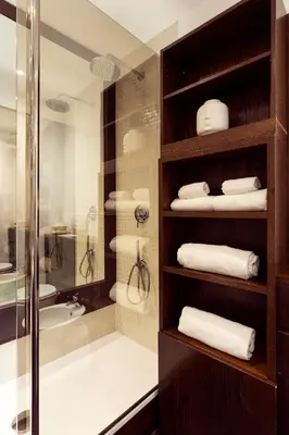 a bathroom with a shower and a bath tub with towels at Your Home at Campo de' Fiori in Rome