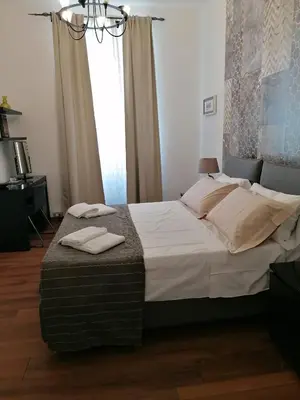 a bedroom with a bed with two towels on it at Monticello apartment via Cavour in Rome