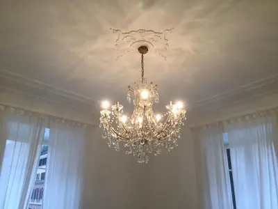 a chandelier hanging from a ceiling in a room at A casa di Fiamma in Rome