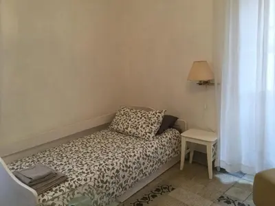 a small bed in a room with a window at A casa di Fiamma in Rome