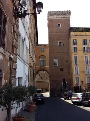 an archway in a building with cars parked on a street at Residenza Maritti Decò Style- Guesthouse in Rome
