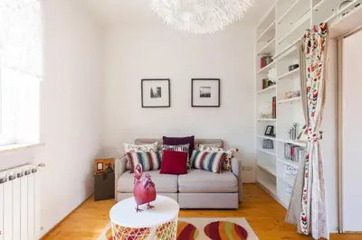 a living room with a couch and a table at Il Nascondiglio del Prete in Rome