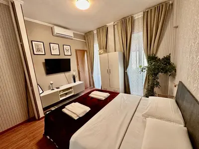 a hotel room with a bed and a television at Pardis Guest house in Rome