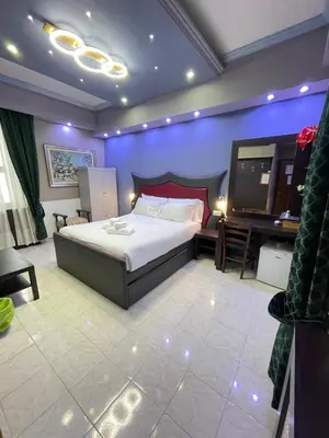 a bedroom with a bed and a flat screen tv at Gold House in Rome