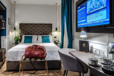 a hotel room with a bed with a backpack on it at Navona Street Hotel in Rome