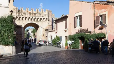 a group of people walking down a street at Rental in Rome - Scala Suite in Rome
