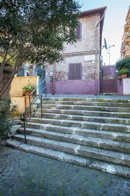 a set of stairs in front of a building at Brancaleone86 - The Loft in Rome