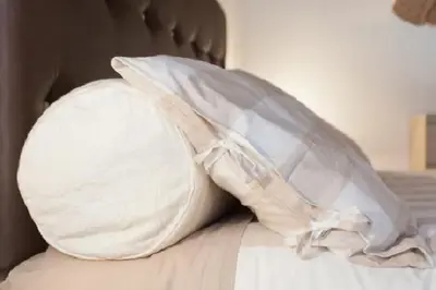 a pillow sitting on top of a bed at Brancaleone86 - The Loft in Rome