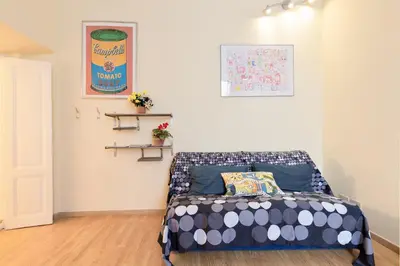 a bedroom with a bed in a room at Casa Vacanze Colosseum by Alice in Rome