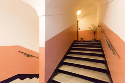 a staircase in a building with a stair case at Casa Vacanze Colosseum by Alice in Rome