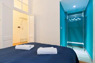a bedroom with a bed and a walk in shower at Casa Vacanze Colosseum by Alice in Rome