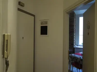 a hallway with a door with a window at A Casa Di Lucia in Rome