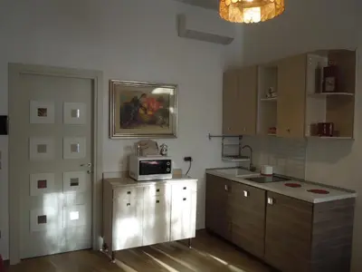 a kitchen with a microwave on top of a counter at A Casa Di Lucia in Rome