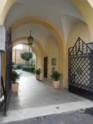 an entrance to a building with a gate and plants at A Casa Di Lucia in Rome