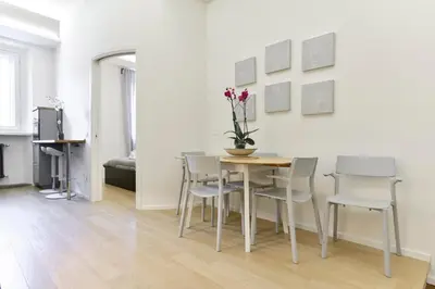 a dining room with a table and chairs at Campo de' Fiori Brand New Apartment in Rome