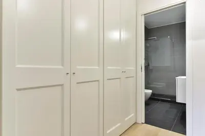 a bathroom with white cabinets and a toilet at Campo de' Fiori Brand New Apartment in Rome