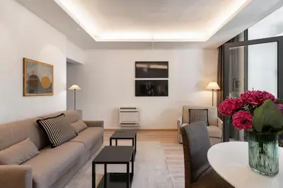 a living room with a couch and a table at Margutta Mews in Rome