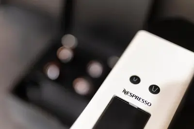 a close up of a remote control with the word suggested at Margutta Mews in Rome