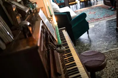 a candle sitting on a piano in a living room at Domus Vintage in Rome