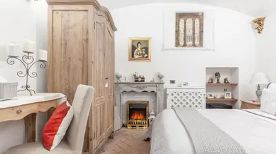a bedroom with a bed and a fireplace at M Empire in Rome
