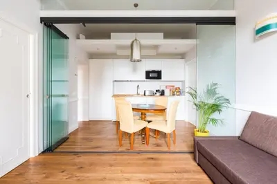 a living room with a table and a couch at Guest House Poerio88 in Rome