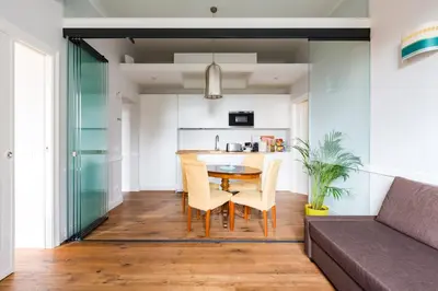 a living room with a table and a couch at Guest House Poerio88 in Rome