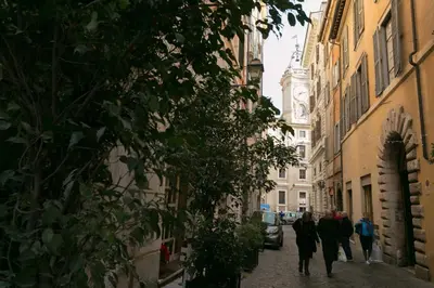 a group of people walking down a street at S.Angelo Terrace sq Navona in Rome