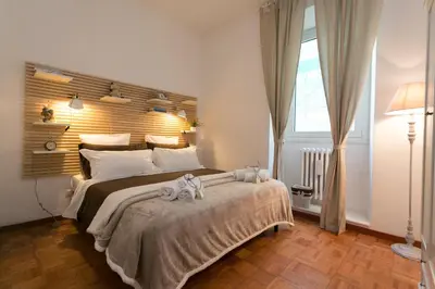 a bedroom with a large bed with towels on it at S.Angelo Terrace sq Navona in Rome