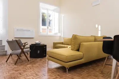 a living room with a couch and a chair at Casa Minerva Al Pantheon in Rome