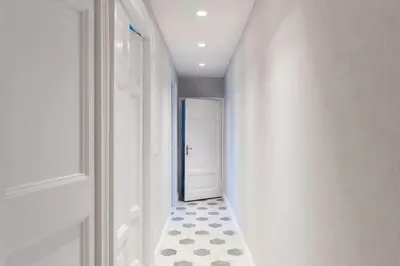 a hallway with a door and a tile floor at Casa Minerva Al Pantheon in Rome