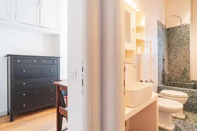 a bathroom with a toilet and a sink at HC - Sunny Apartment in Testaccio! in Rome