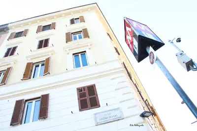 a building with a flag in front of it at Federici Guest House in Rome