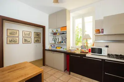 a kitchen with a counter top and a microwave at Federici Guest House in Rome