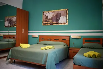 a bedroom with two beds with stuffed animals on them at I Petali Guest House in Rome