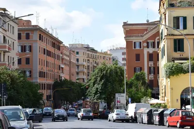 a busy city street filled with cars and buildings at I Petali Guest House in Rome