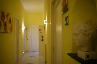 a room with a bust of a head on a shelf at I Petali Guest House in Rome