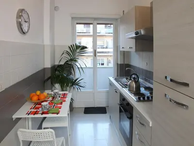 a kitchen with a table with oranges on it at Marina Home in Rome