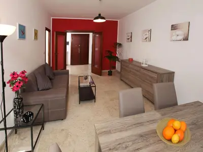 a living room with a couch and a table at Marina Home in Rome