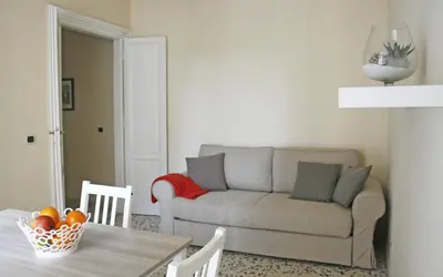 a living room with a couch and a table at Capital Flat 9/b in Rome