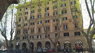 a large building with people standing in front of it at Capital Flat 9/b in Rome