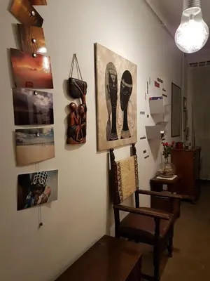 a room with a table and pictures on the wall at Robta's Dream Home in Rome