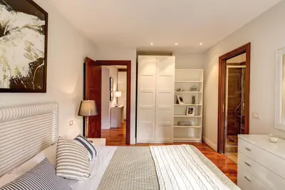 a bedroom with a bed and a closet at Appartamento con vista sul Vittoriano in Rome