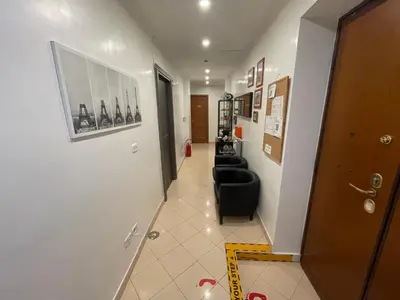 a hallway with a black couch in a room at KayDee GuestHouse in Rome